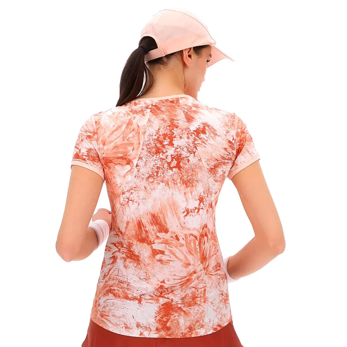 חולצת טניס נשים לוטו TECH W IV - D2 TEE LOTTO עם עיצוב פרחים בצבעים כתומים ורקע בהיר