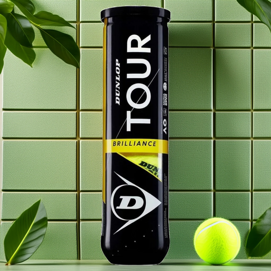 כדורי טניס Dunlop Tour Brilliance (4 כדורים בקופסה) | דנלופ על רקע ירוק עם כדור טניס צהוב.